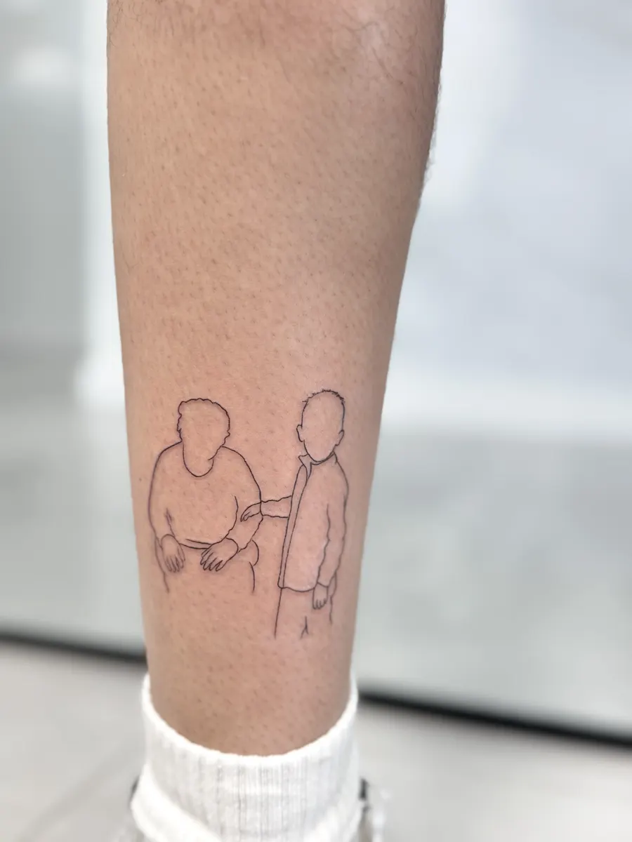 Two pure outline figures, an elderly person with a cane being walked arm in arm, fine line tattoo on the calf